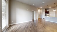 Located at 9600 Gaylord Pkwy in Frisco, TX, this single-floor, 2-bedroom, 2-bathroom residence offers a thoughtfully designed layout with quality finishes throughout. The open-concept kitchen and living area serves as the heart of the home, featuring rich dark espresso cabinetry extending to the ceiling, granite countertops, a mosaic tile backsplash, stainless steel appliances, and durable wood-look flooring. The living room is bright and airy, with natural light streaming through blinded windows and a ceiling fan overhead.

Both bedrooms are carpeted for comfort and include ceiling fans. The spacious primary bedroom offers generous proportions, natural light, and direct access to a private closet. The secondary bedroom is equally well-sized with its own closet. Each bathroom is finished with dark wood vanities, granite countertops, and tile work. The primary bath features both a separate walk-in shower with a glass enclosure and a soaking tub, while the secondary bath includes a tiled tub-shower combo. Wood-look flooring runs through the bathrooms, complementing the cohesive design. Neutral gray tones throughout create a calm, modern ambiance ideal for everyday living in the heart of Frisco.