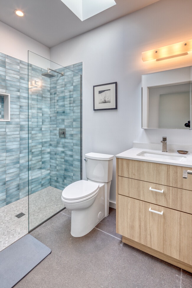 Skylight in bathroom highlights the tilework. - 4711 N 14th St