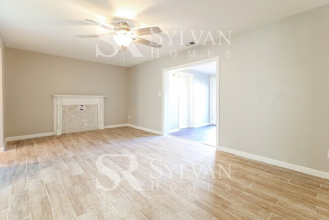 Building Photo - Venture outside to the expansive backyard,...