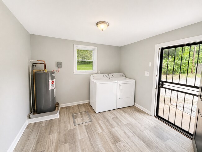 Separate laundry room with brand new washer and dryer - 1524 N Parkway