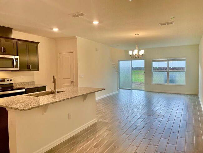Building Photo - MOVE IN NOW!! NEW 3 x2.5 TOWNHOME WITH 1 C...
