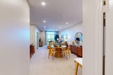 Located at 475 King St E in Kitchener, Ontario, this well-appointed one-bedroom, one-bathroom unit offers a thoughtfully designed open-concept layout. The combined kitchen and living area forms the heart of the space, with recessed lighting and plush wall-to-wall carpeting creating a warm, inviting atmosphere. The kitchen is equipped with stainless steel appliances, crisp white cabinetry, and a peninsula breakfast bar with seating — ideal for casual dining or entertaining. Adjacent to the kitchen, the dining and living areas flow seamlessly together, benefiting from large windows that draw in abundant natural light. The living room extends to a private balcony, offering pleasant outdoor views. The bedroom is a comfortable retreat featuring a large sliding-door closet and a generously sized window that frames bright outdoor scenery. The full bathroom includes a soaker tub with tiled surround and chrome fixtures. A dedicated laundry room with a stacked washer and dryer unit, along with built-in shelving, adds everyday convenience. Throughout the unit, neutral tones and clean finishes contribute to a cohesive, modern aesthetic well-suited for comfortable urban living.