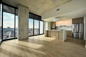 The living room and kitchen of The Page at Three Light Luxury Apartments - Three Light Luxury Apartments