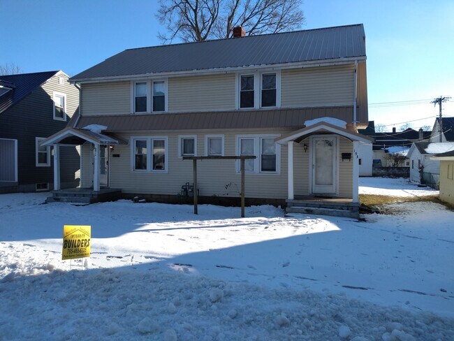 151 is on the left - 153 W College St