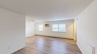 Located at 2601 Blair Mill Road in Willow Grove, PA, this well-appointed one-bedroom, one-bathroom unit offers a thoughtfully laid-out single-floor design. The open living room greets you with light wood-look flooring, crisp white walls, and natural light streaming through multiple windows fitted with blinds. A wall-mounted air conditioning unit and baseboard heating ensure year-round comfort. The galley-style kitchen is efficiently designed with white shaker cabinetry, granite-look countertops with a tile backsplash, a stainless steel sink, and white appliances including a gas range, microwave, and refrigerator — all complemented by the same light wood flooring that flows throughout the main living areas. The bedroom is a comfortable, carpeted retreat featuring a large double-door closet, a window with natural light, and baseboard heating. A hallway connects the main living spaces and provides access to the full bathroom, which features marble-look tile flooring, a full soaking tub with white subway tile surround, and clean, modern finishes. A dedicated closet and entry hallway round out this practical and move-in ready home.