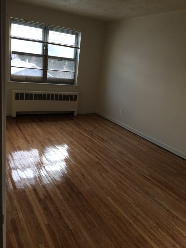 1st floor master bedroom featuring hardwood floors - 210 East 238th Street
