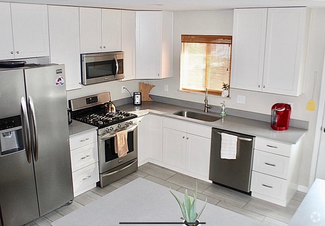 Updated kitchens with stainless appliances - 5019 W 34th Ave