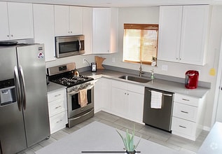 Updated kitchens with stainless appliances - 5019 W 34th Ave