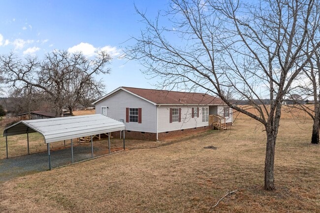 Building Photo - Charming 4-Bedroom Home on Spacious 2.64-Acre Lot in Graham, NC