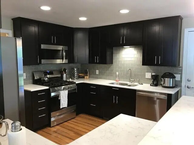 Updated kitchen with quartz countertops. - 605 NW Linden Ave