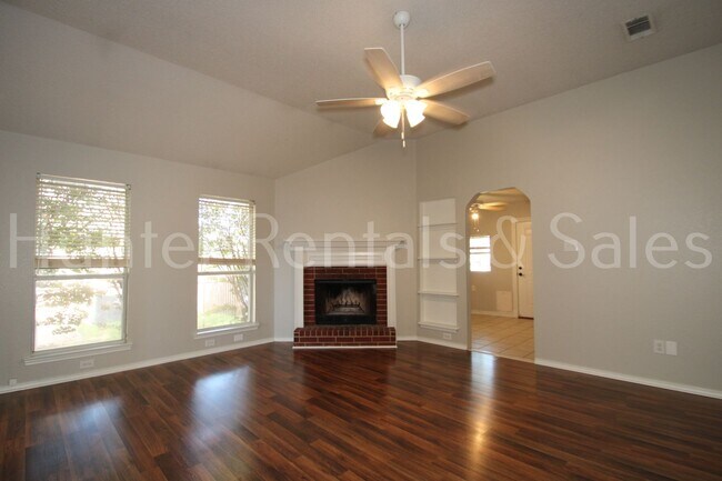 Building Photo - Exceptional Living with Vaulted Ceilings, Cozy Fireplace & Expansive Outdoor Space
