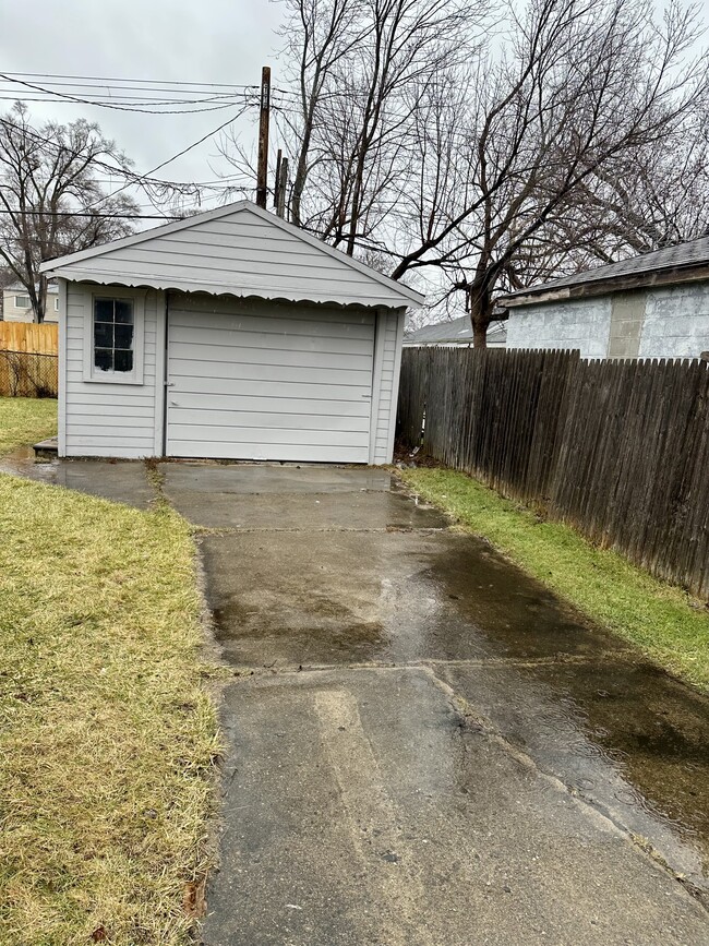 detached garage with large driveway - 7083 Victory Ave