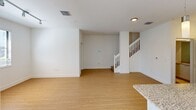 This contemporary townhouse in Miramar, Florida offers 1080 square feet of living space across two floors. The home features 2 bedrooms, including a generous 180 square foot primary bedroom, and 3 bathrooms for added convenience. The interior boasts a modern aesthetic with clean lines and a neutral color palette, complemented by light wood-look flooring throughout.

The kitchen is a highlight, featuring sleek white cabinetry, granite countertops, and stainless steel appliances, including a built-in microwave. A sliding glass door in the kitchen area provides access to an outdoor space and floods the room with natural light.

Bedrooms are spacious and bright, with large windows adorned with white blinds, offering ample natural light and views of the lush surroundings. The bathrooms are well-appointed, featuring modern fixtures, glass shower enclosures, and granite vanity tops.

The property includes a dedicated laundry area with full-sized washer and dryer units. A white-railed staircase connects the two floors, adding to the home's open and airy feel.

Outside, residents can enjoy a tropical paradise with palm trees, manicured lawns, and a pergola-covered walkway. The exterior of the building features a mix of white stucco and stone accents, creating an attractive curb appeal.

Located at 11831 SW 43rd St in Miramar, this townhouse offers a perfect blend of modern comfort and Florida charm, ideal for those seeking a contemporary living space in a vibrant community.