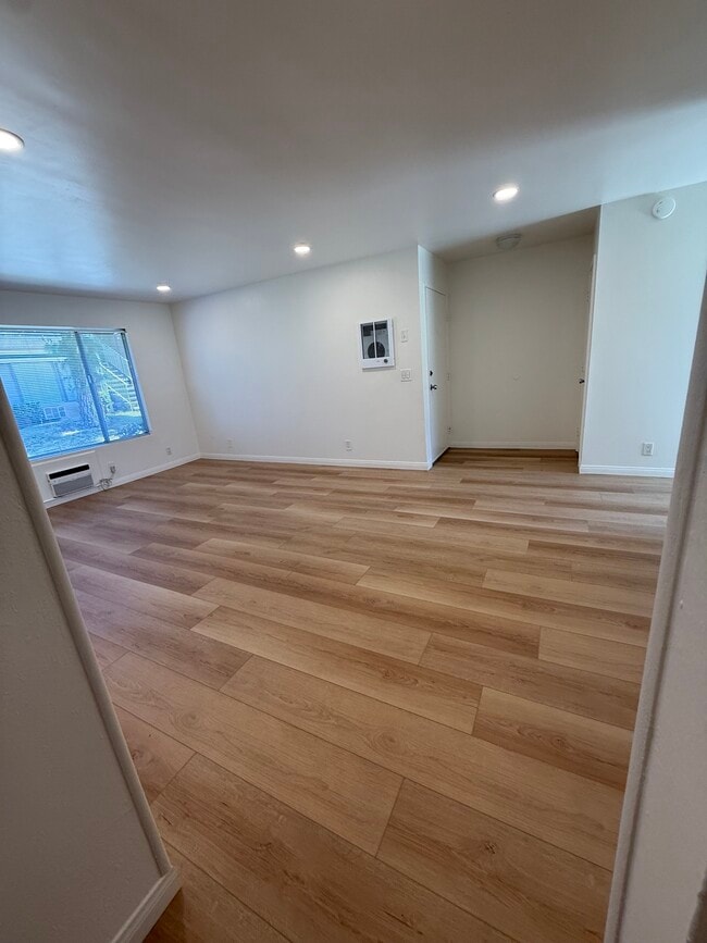 Main living area with new flooring - 4475 Dale Ave