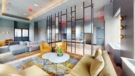 Imagine waking up to panoramic cityscapes and the vibrant energy of New York right at your doorstep. This extraordinary 1,870 square foot living space is not just a home; it's a statement of success and a gateway to the lifestyle you've always aspired to.

As you step into the expansive living area, you're immediately struck by the flood of natural light pouring through floor-to-ceiling windows, offering unparalleled views of the iconic skyline. The open-concept design creates a sense of boundless space, perfect for both elegant entertaining and comfortable everyday living.

The interior is a masterpiece of modern design, featuring a harmonious blend of sleek lines and luxurious textures. The vibrant teal sofas set against the mesmerizing blue-toned area rug create a captivating focal point, reminiscent of the city's energy and sophistication.

For the culinary enthusiast, the gourmet kitchen is a dream come true. The striking blue island with bar seating is not just functional but a work of art, complemented by state-of-the-art appliances and ambient lighting that sets the mood for any occasion.

The attention to detail is evident in every corner, from the carefully curated furnishings to the thoughtful layout that maximizes both space and style. Whether you're hosting a cocktail party or enjoying a quiet evening, this home adapts seamlessly to your needs.

This is more than just a living space; it's an opportunity to immerse yourself in the pinnacle of urban living. Here, every day feels like a luxury hotel stay, with the comfort and personalization of your own home. Don't just observe the city – become part of its vibrant tapestry in this unparalleled urban sanctuary.