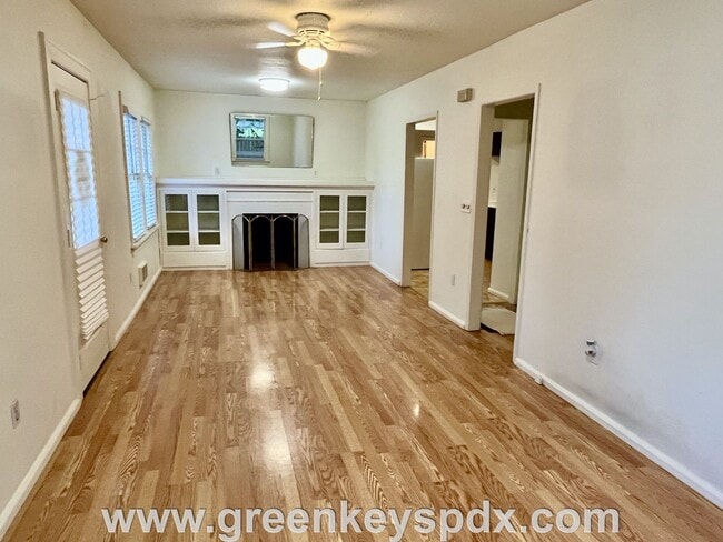 Building Photo - This 3-bedroom 1-bathroom house has a large front yard and a mostly fenced backyard.