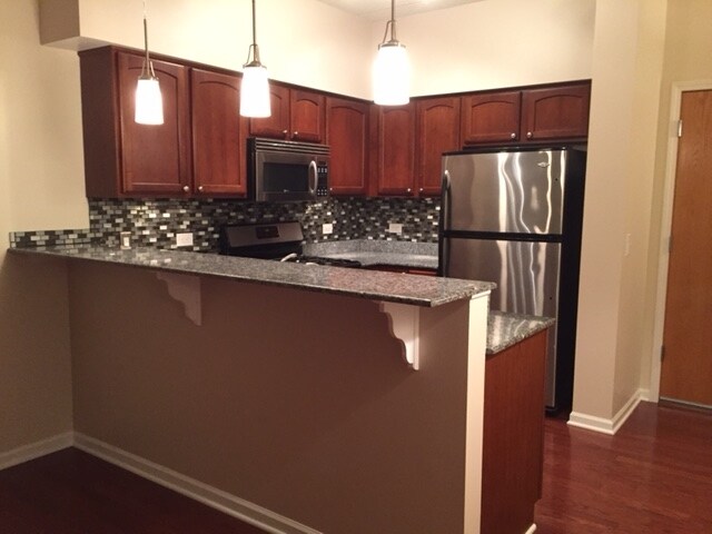 New paint, backsplash and lighting in kitchen - 405 S Creekside Dr
