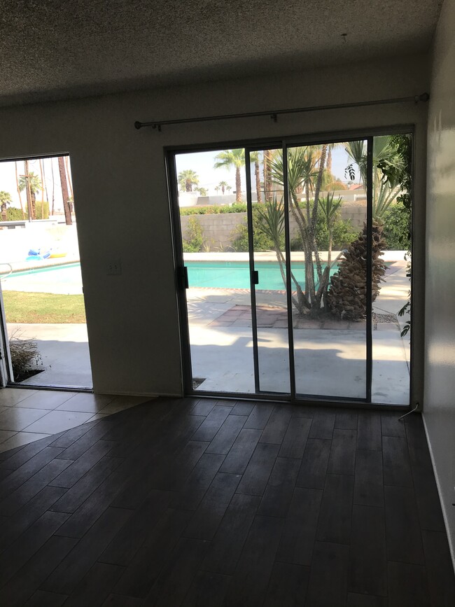 View from the living room to pool - 74442 Driftwood Dr