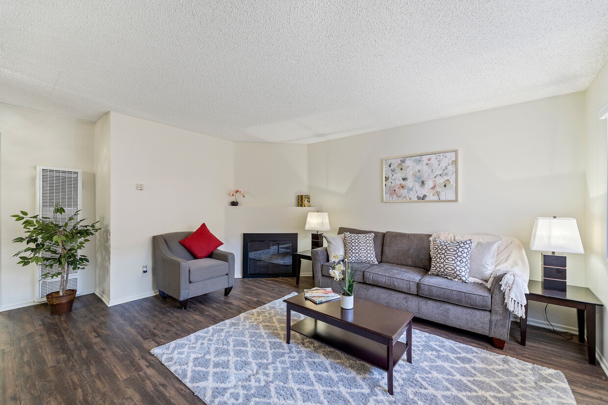 Spacious living room with a fireplace at the Enclave apartment in Studio City - The Enclave
