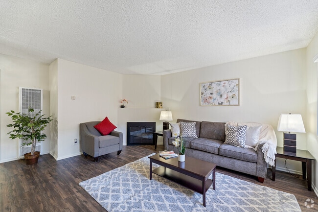 Spacious living room with a fireplace at the Enclave apartment in Studio City - The Enclave