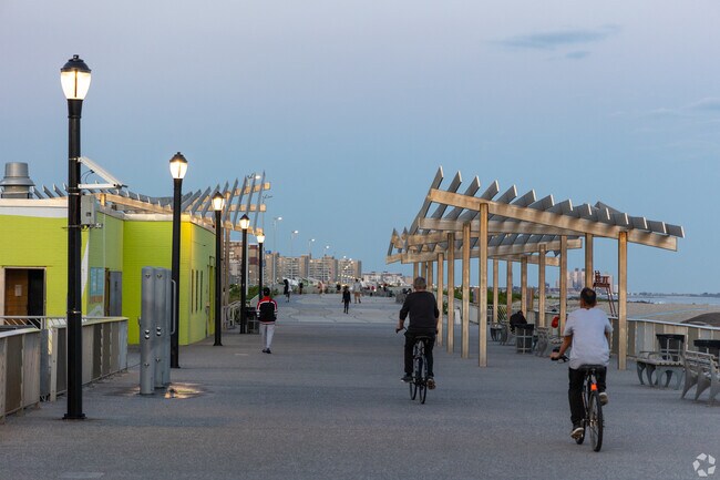 Relish the soothing ocean breeze at Rockaway Beach Boardwalk.