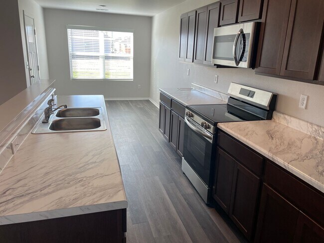 Building Photo - *New Year, New Home Special* BRAND NEW Thr...