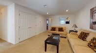 Located at 1600 W Creek Village Dr in Elkton, Maryland, this single-floor residence offers a well-organized and functional layout designed for comfortable living. The kitchen is efficiently designed with light maple cabinetry, black appliances including a refrigerator, electric range, microwave, and dishwasher, all set atop tile flooring. A pass-through window connects the kitchen to the living area, enhancing the open feel of the space. The living room is carpeted and features a corner fireplace, recessed lighting, and natural light filtering through window treatments, creating a warm and inviting atmosphere. Adjacent to the living room, a dedicated dining area accommodates a full-sized table and chairs, with a window providing views of the surrounding greenery. The bedrooms are carpeted and bright, each with windows dressed in blinds that allow for ample natural light. The bathroom is finished with tile flooring, a wood-toned vanity, and well-lit mirror, offering a clean and practical space. Throughout the residence, a neutral color palette of warm whites and beiges contributes to a cohesive and calming ambiance. The thoughtful floor plan, visible in the dollhouse view, ensures smooth flow between all areas of the home.