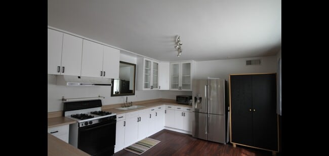 Standing next to the kitchen counter oops this photo snuck in please keep in mind that the table und - 14715 Addison St