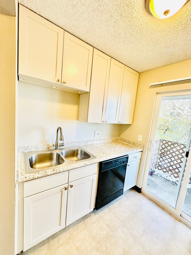 Step into a gleaming kitchen designed for elegance and practicality. - Villa Rosa