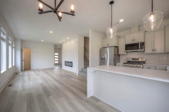 Bright Open Living Space with Electric Fireplace & Natural Light - 22907 W 72nd Ter