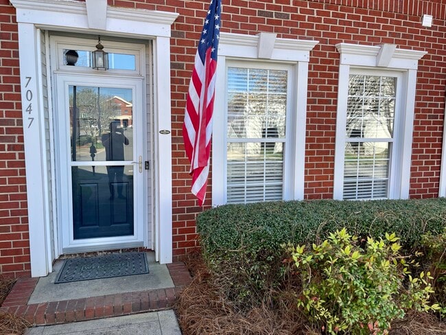 Main entrance with storm door - 7047 Brighton Park Dr
