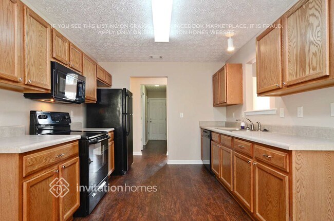 Foto del edificio - 5013 Grist Mill Dr