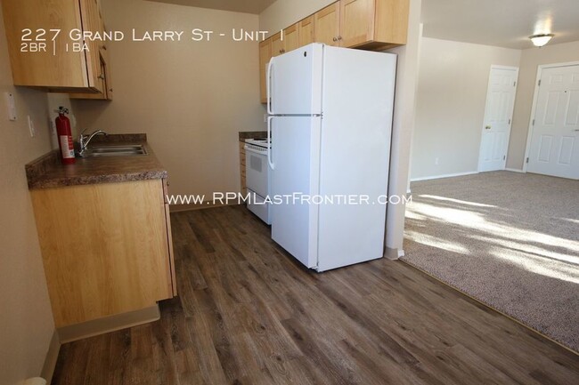 Building Photo - Remodeled top floor apartment! Close to base!