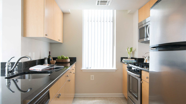 Kitchen with Stainless Steel Appliances and Gas Stove - The Reserve at Clarendon Centre