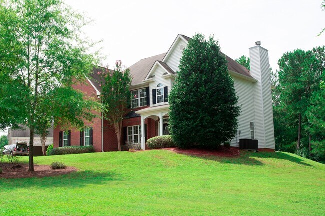 Building Photo - Executive Home with 5 Bedrooms and 3 Full ...