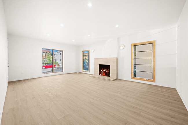 Living Room with decorative fireplace - 860 S Curson Ave