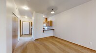 Located at 4105 Consolidation Ave in Bellingham, WA, this two-bedroom, two-bathroom unit offers a well-organized single-level layout. The combined kitchen and living area forms the heart of the home, where a functional kitchen features warm oak cabinetry, dark countertops, white appliances, and a convenient breakfast bar that opens directly to the carpeted living space. The living room is anchored by a tile-surround fireplace, adding a focal point and cozy ambiance to the area. A hallway connects the main living space to both bedrooms and bathrooms. The spacious primary bedroom includes a sliding glass door opening to a private balcony with views of surrounding greenery. The second bedroom features a large window overlooking mature trees, filling the room with natural light, along with a closet for ample storage. Both bedrooms are finished with plush wall-to-wall carpeting and neutral tones. The bathrooms are clean and functional, each featuring a tub-shower combination, wood-toned vanity cabinetry, and tile flooring. Throughout the unit, crisp white walls, consistent trim work, and practical finishes create a cohesive and comfortable living environment well-suited for everyday living in the Pacific Northwest.