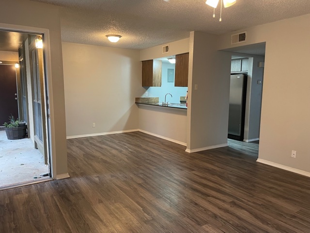 one bedroom with wood flooring - Ashley Oaks Apartments