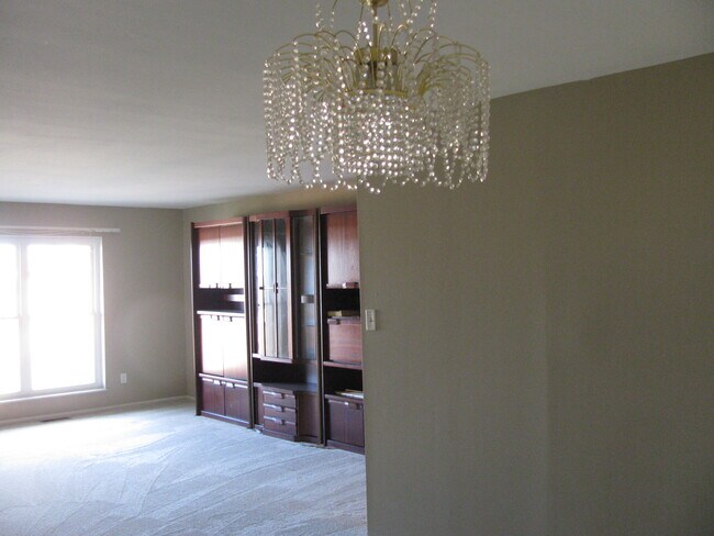 Dining room. Chandelier replaced with modern ceiling fan with lights.) - 10344 Forest Brook Ln