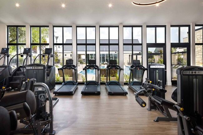 Stay fit and healthy with a fully-equipped fitness center, offering a variety of equipment for all your workout needs. - Windsor West Plano