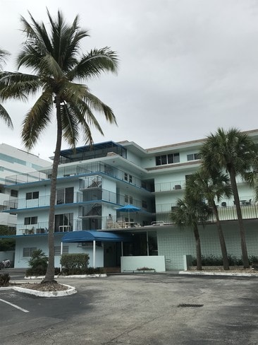 Building, gated parking lot. - 2539 S Bayshore Dr