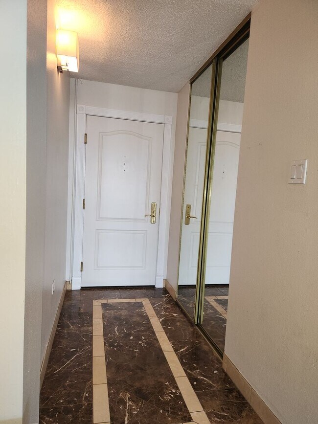 Building Photo - Affordable High Rise Condo in the heart of...