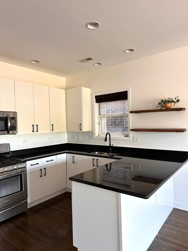 Updated kitchen with SS appliances, floating shelves - 3103 W Armitage Ave