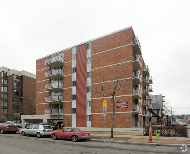 Photo du bâtiment - Camelot Suites