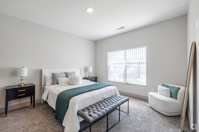 2BR, 2BA - 1,087SF - The Shoreline - Primary Bedroom - Mona Shores Flats