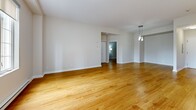 Located at 205 Rue Laurier in Gatineau, Quebec, this well-appointed 3-bedroom, 1-bathroom unit offers a comfortable and functional single-floor layout. Warm hardwood flooring flows consistently throughout the space, creating a cohesive and inviting atmosphere.

The open-concept kitchen and living area serves as the heart of the unit. The kitchen features warm-toned wood cabinetry, ample counter space, a peninsula with a breakfast bar, pendant lighting, and includes appliances such as a white electric range, refrigerator, and built-in microwave. The adjoining living area is generously sized, bathed in natural light from large windows that overlook the surrounding neighbourhood.

The three bedrooms are well-proportioned and finished with the same warm hardwood floors and neutral walls. One bedroom features a built-in closet with bifold doors and a distinctive glass-panelled French door, adding an elegant touch. The bedrooms also include baseboard heating for year-round comfort.

The bathroom is thoughtfully designed with a curved, angled vanity featuring white cabinetry, stone-toned countertops, large mirrors, recessed lighting, and a separate shower. A dedicated laundry room houses a full-sized washer and dryer with overhead shelving, adding everyday convenience. An entrance closet completes this practical and well-organized home.