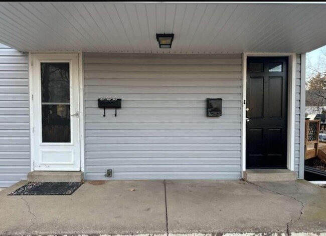 Side porch- Left door to 1st Fl and to basement, R door to 2nd Fl - 495 5th Ave