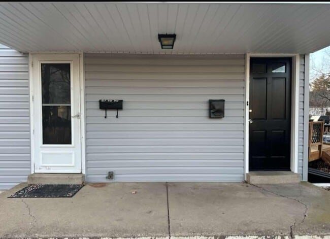 Side porch- Left door to 1st Fl and to basement, R door to 2nd Fl - 495 5th Ave