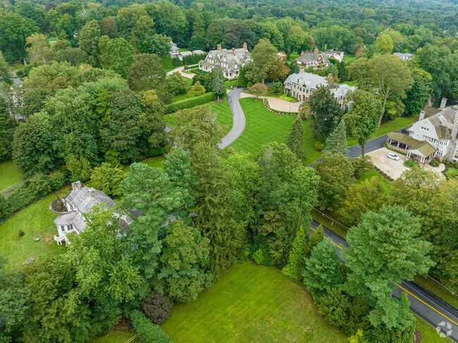 Sprawling lawns nestled among rows of trees in Ridgefield.