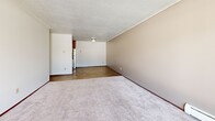 Located at 1701 W Burnsville Pkwy in Burnsville, MN, this single-floor unit offers 2 bedrooms and 3 bathrooms within a well-organized layout. The open-concept living, dining, and kitchen area provides a comfortable communal space, with wood-look flooring in the kitchen and dining zone transitioning to plush carpet in the living area. The kitchen features dark espresso cabinetry, granite-look countertops, a stainless steel sink with a gooseneck faucet, and stainless steel appliances. A hallway connects the main living area to the bedrooms, each finished with soft carpet and equipped with sliding windows that bring in natural light and outdoor views of the surrounding landscape. The spacious primary bedroom offers generous room to furnish comfortably. Three bathrooms are distributed throughout the unit, each featuring white tile accents, a vanity with a white countertop, and chrome fixtures. One bathroom includes a tiled tub-and-shower combination with mosaic tile flooring, while others serve as convenient half or three-quarter baths. Four closets provide abundant storage throughout. A private patio adds valuable outdoor space, and textured ceilings are consistent throughout the unit.